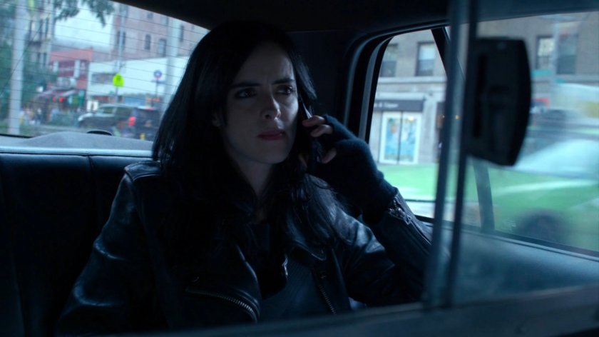 Jessica in the back of a taxi cab.