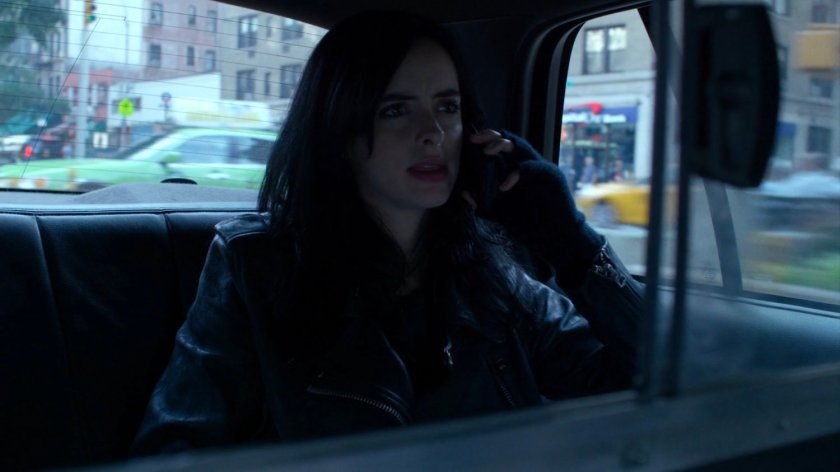 Jessica in the back of a taxi cab.