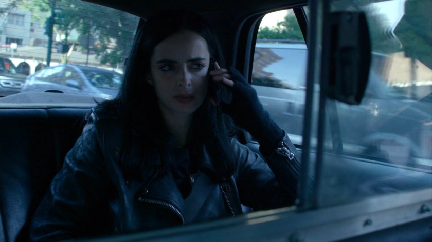 Jessica in the back of a taxi cab.