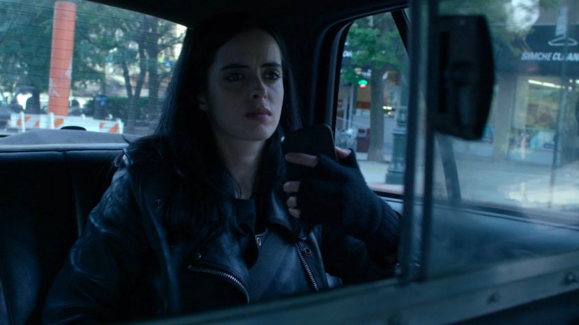 Jessica in the back of a taxi cab.