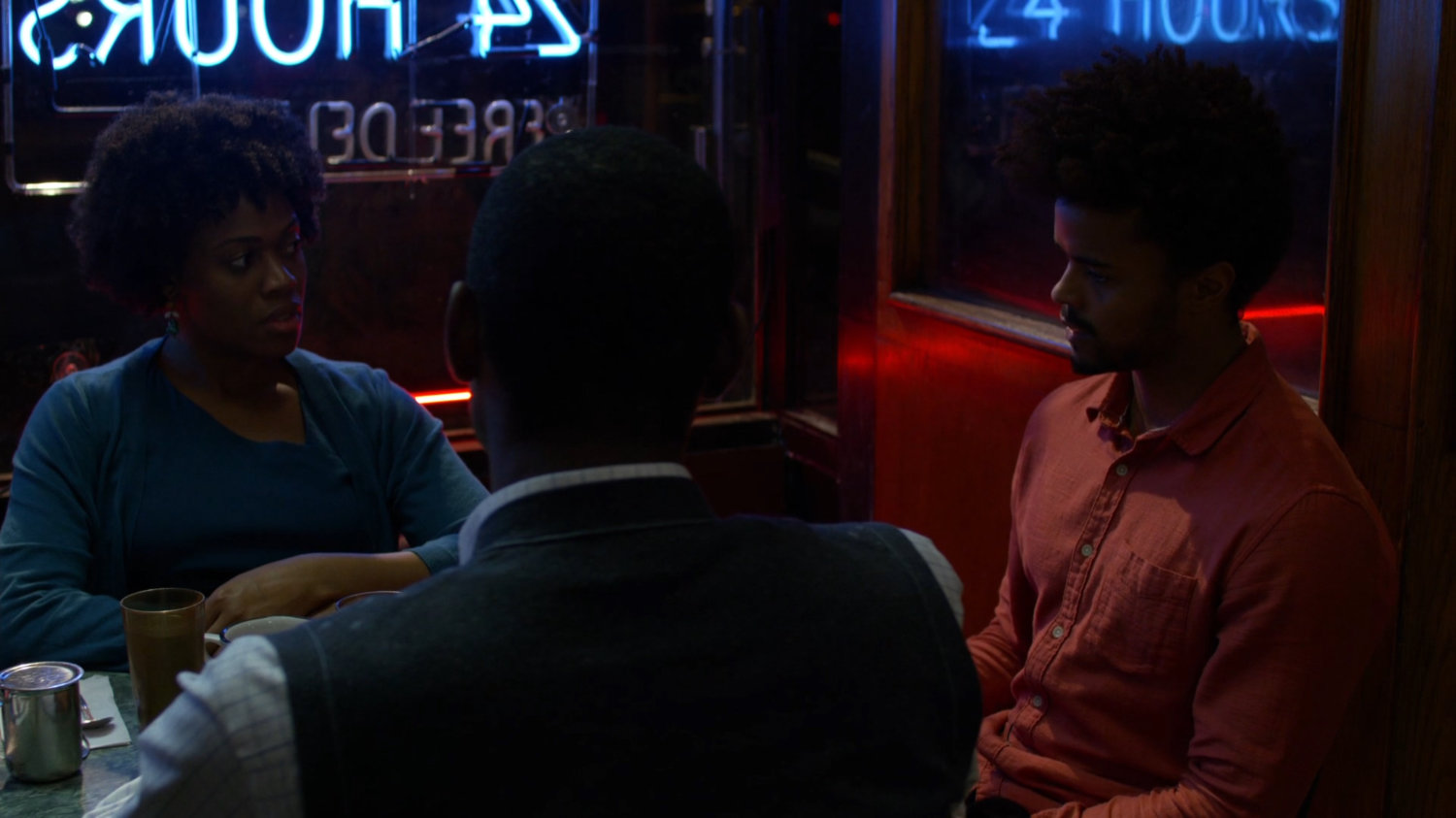 Malcolm and other Kilgrave's anonymous members meeting in Broadway Restaurant at night.