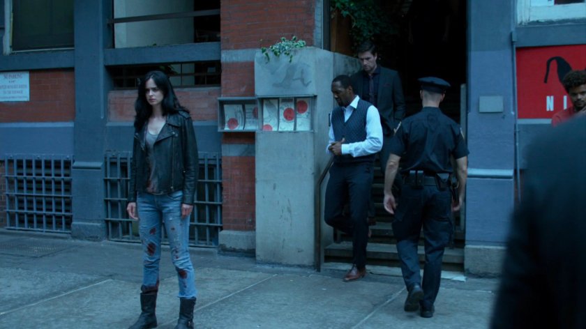 Jessica and others on sidewalk outside Niku Japanese restaurant.