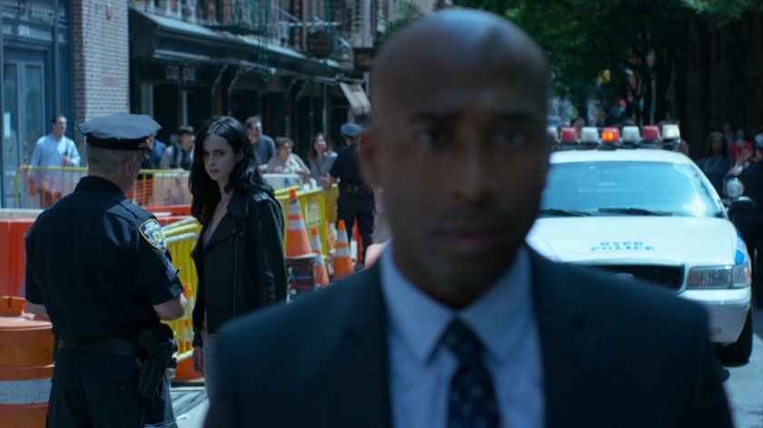 Jessica watching police interview outside Niku Japanese restaurant.