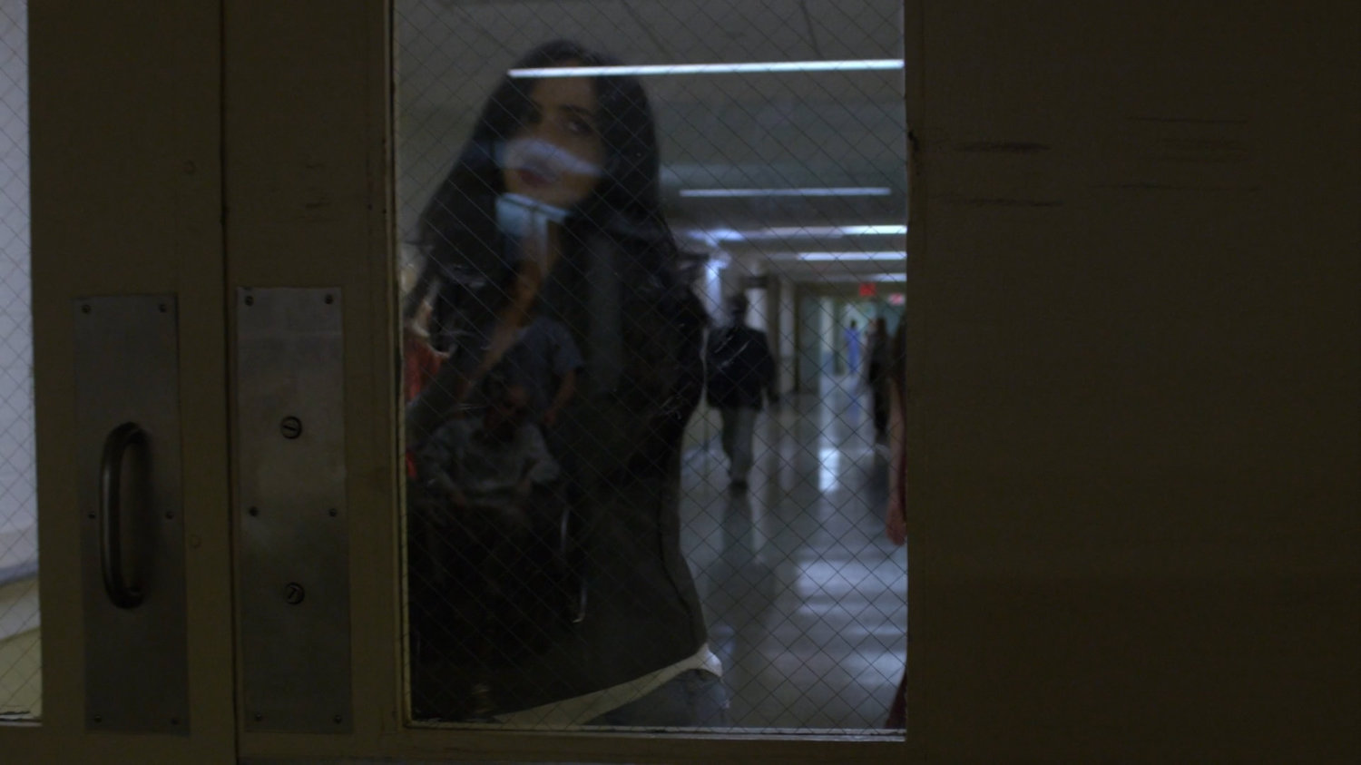 Jessica entering Riverbank morgue.