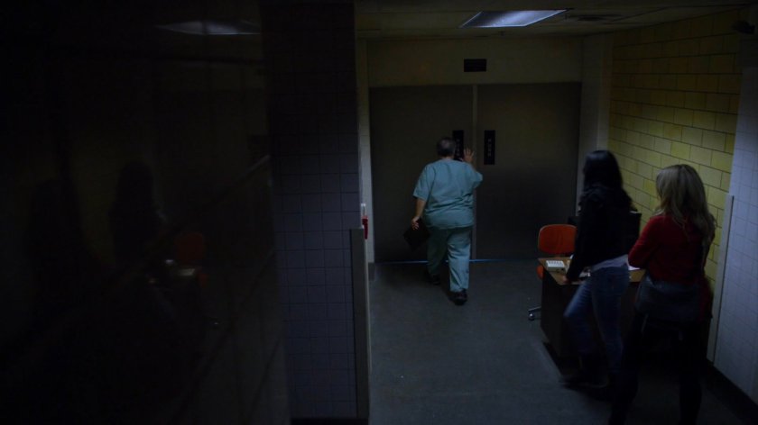 Jessica and Trish following worker into Riverbank morgue.