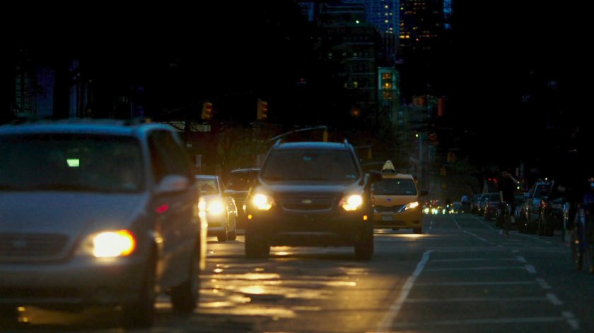 Cars driving along New York street.