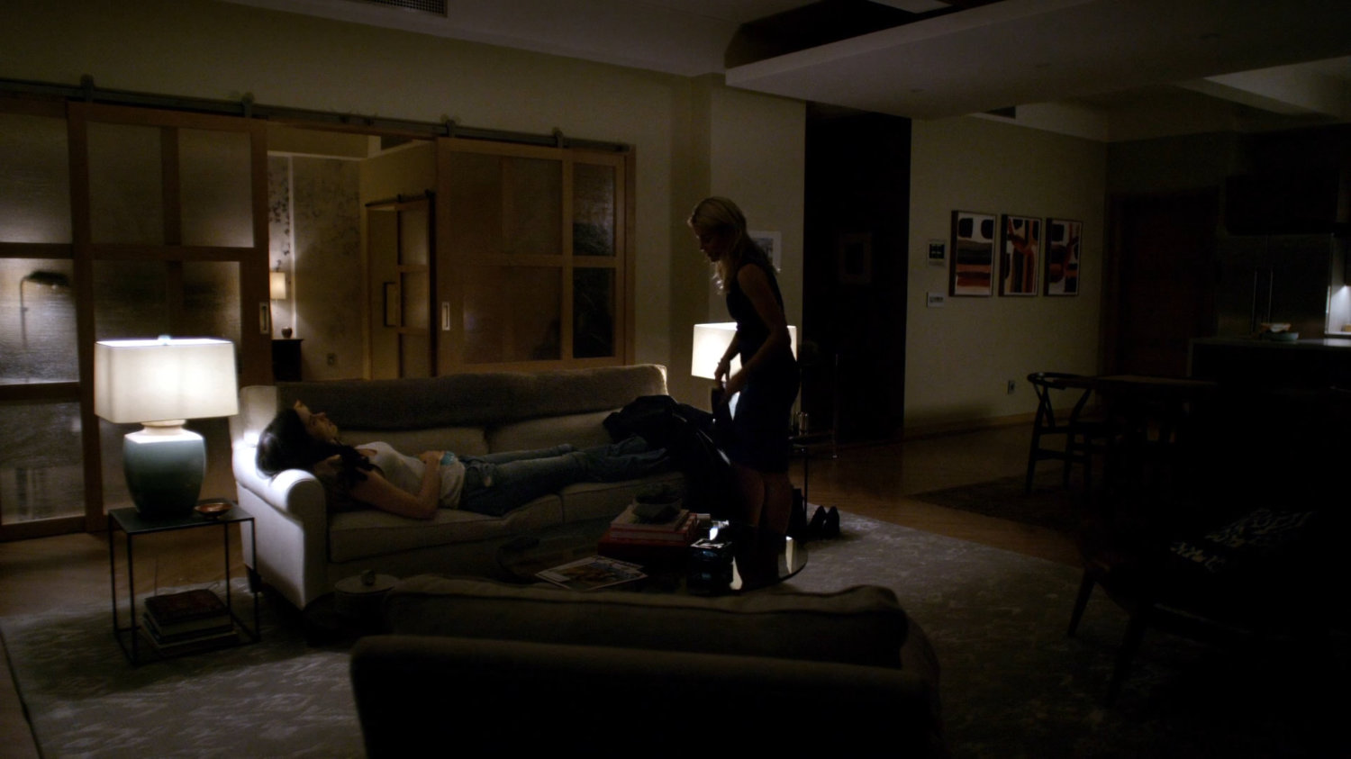 Trish getting Jessica comfortable on her couch.
