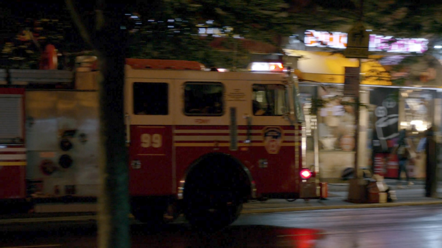 Fire engine pulling up outside Luke Cage's bar.