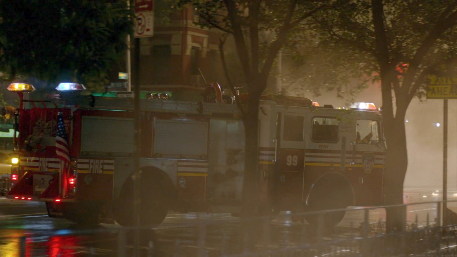 Fire engine pulling up outside Luke Cage's bar.