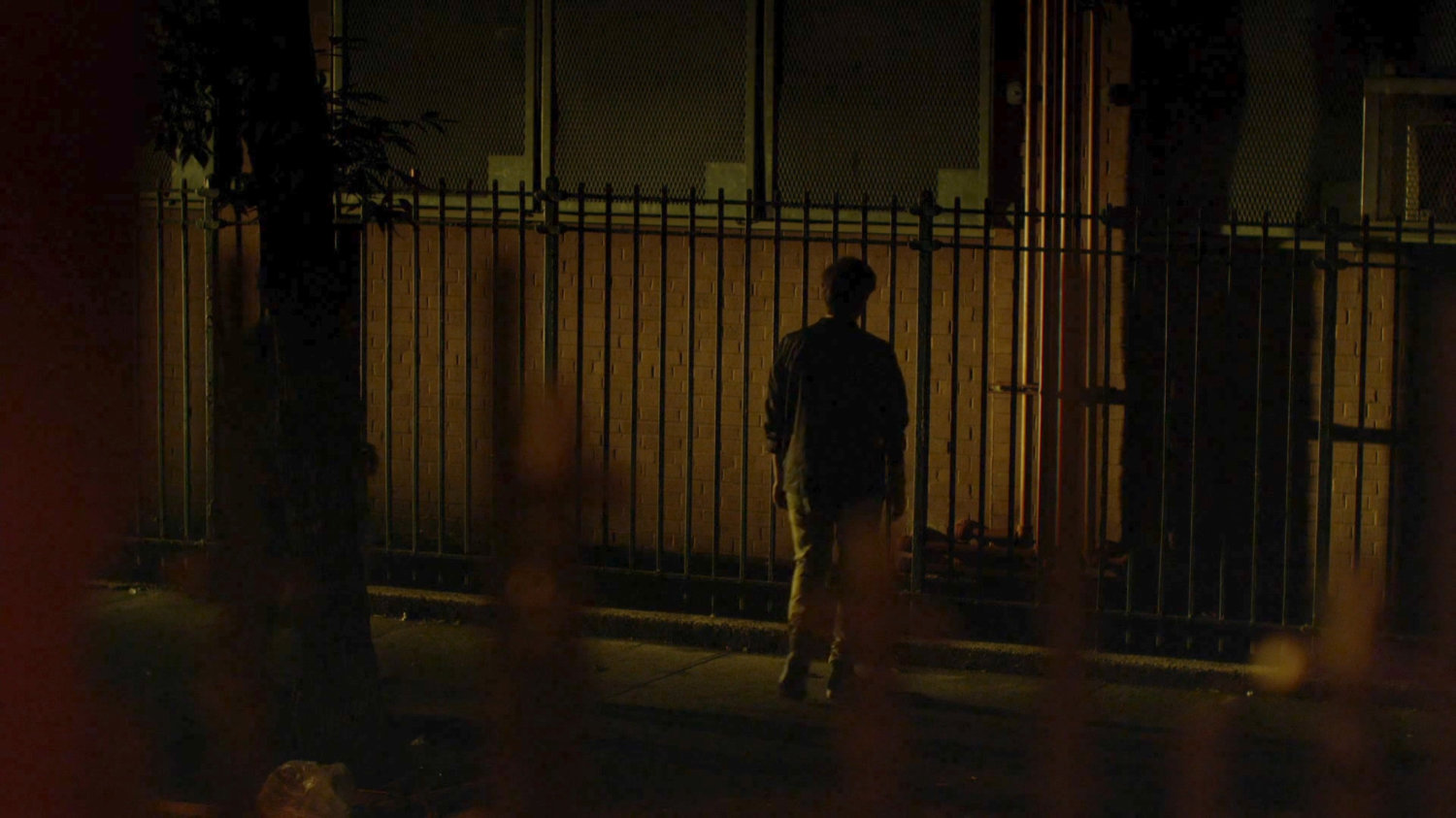 Man told to stand by fence, forever, by Kilgrave, across the street from Delaney Hall.