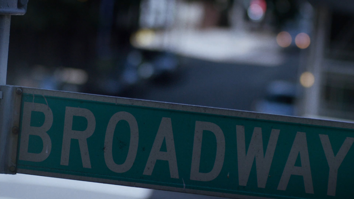 Close up of street sign for "Broadway."