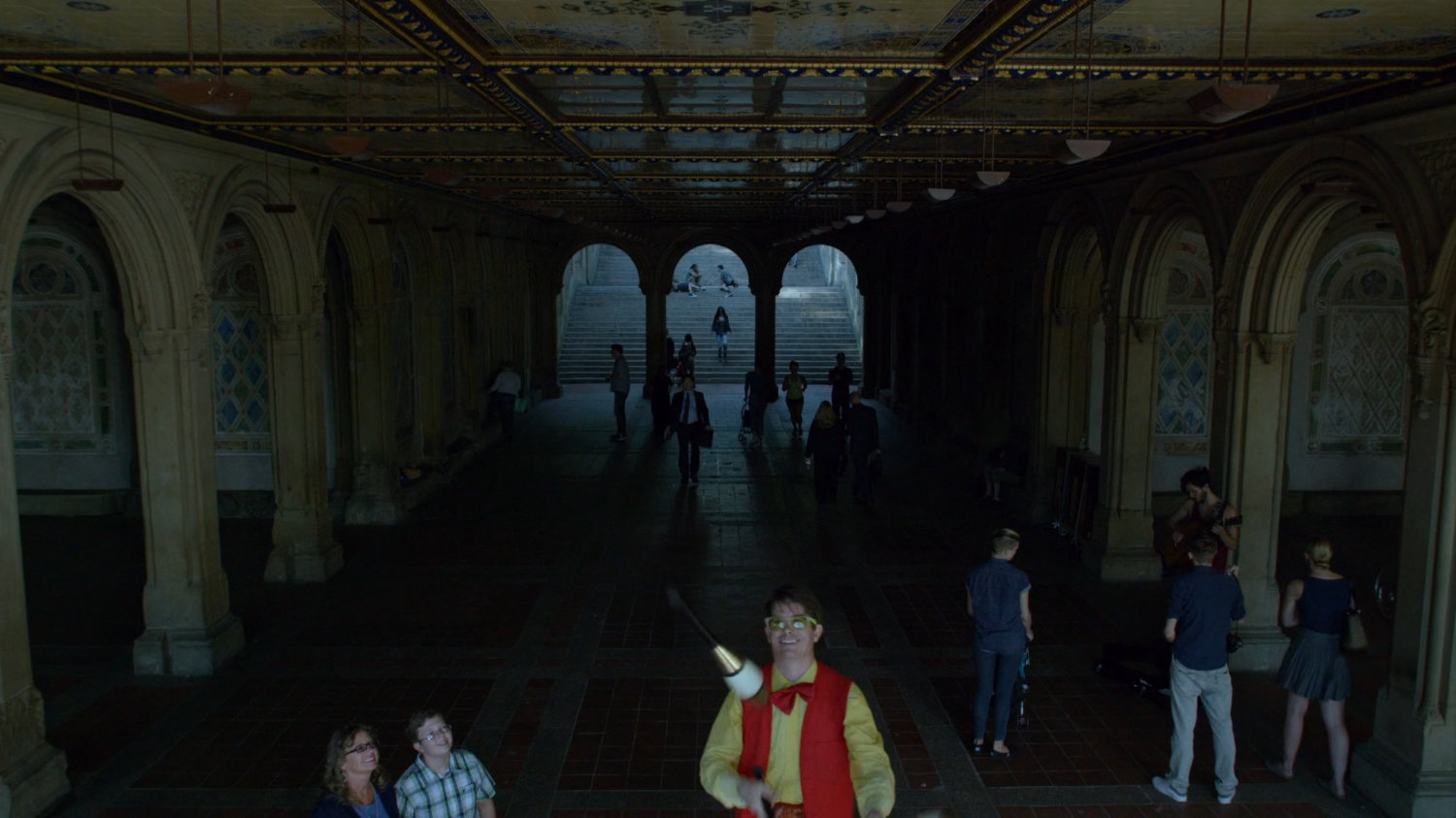 Jessica walking down stairs into Bethesda Terrace in Central Park.