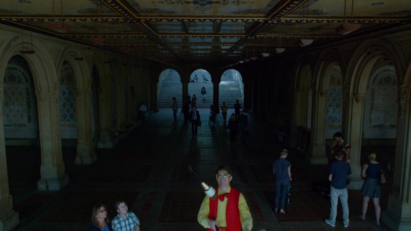 Jessica walking down stairs into Bethesda Terrace in Central Park.