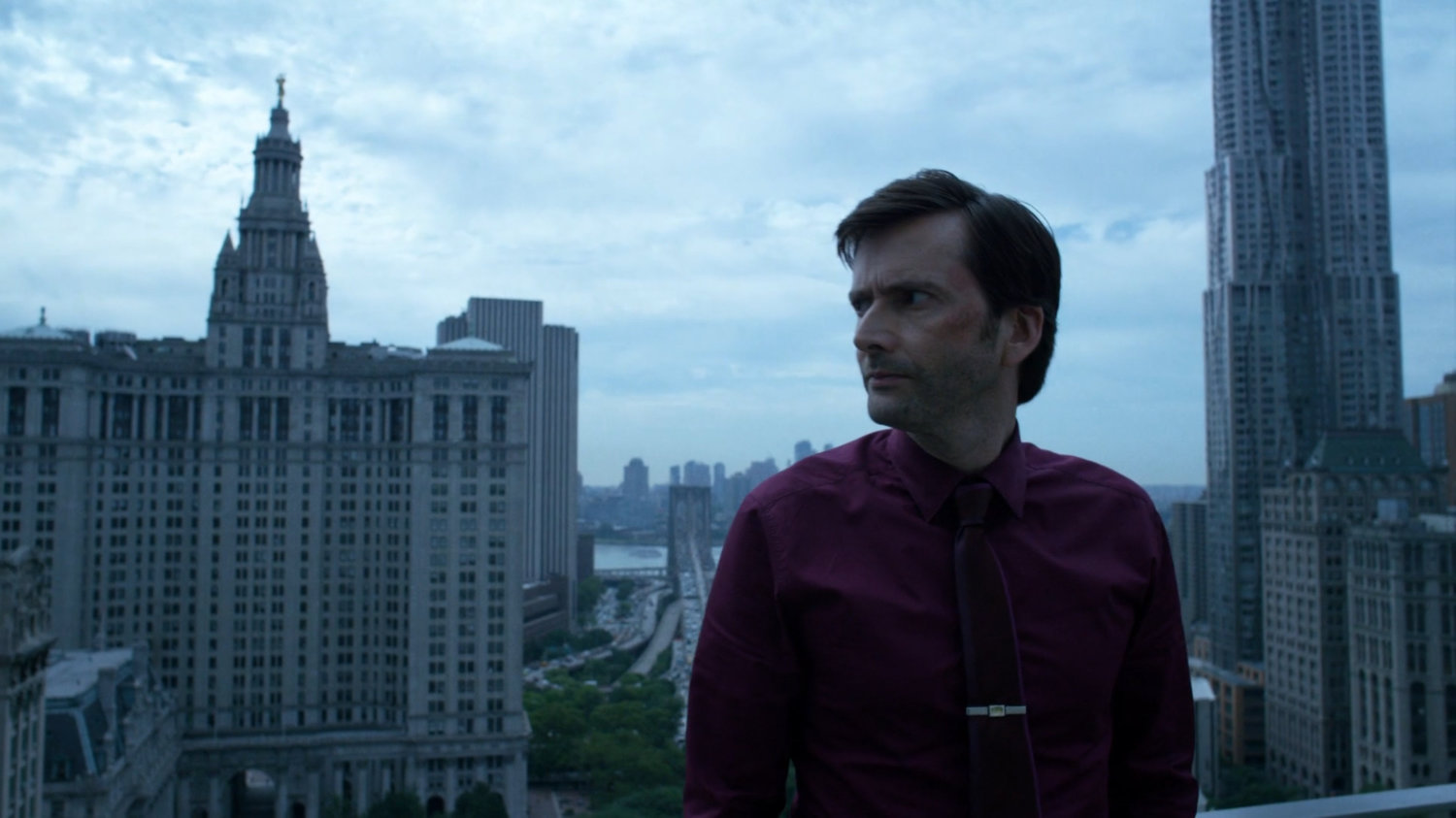 Kilgrave on balcony of New York City penthouse.