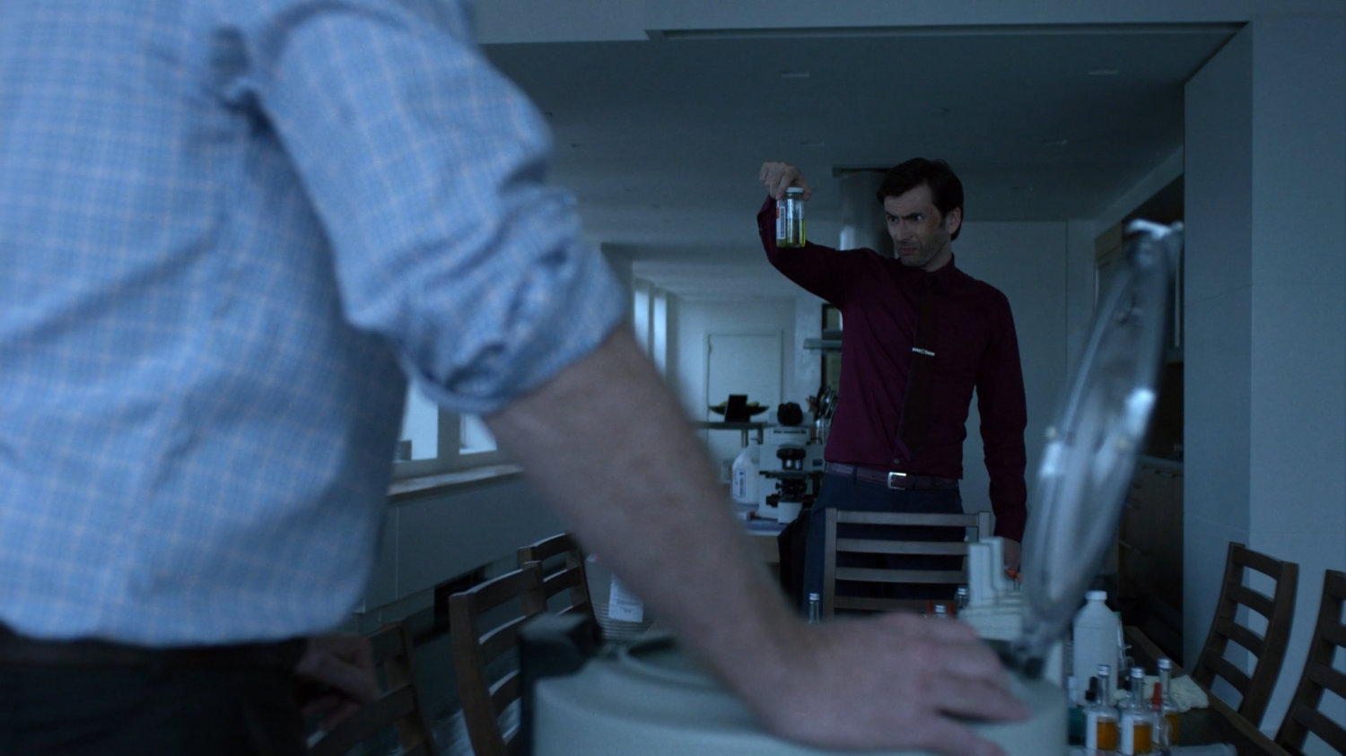 Kilgrave and Albert working on enhancing powers in New York City penthouse.