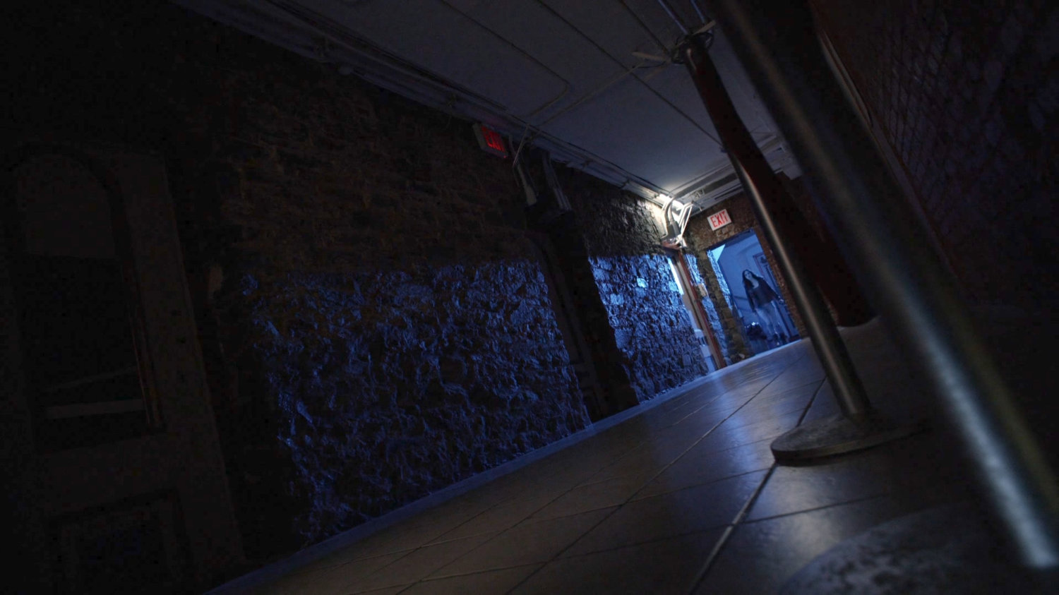 Jessica entering hallway in Delaney Hall.