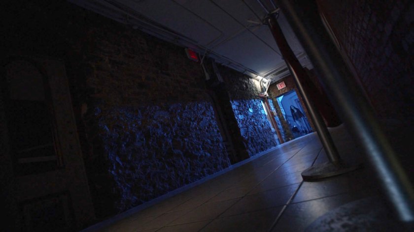 Jessica entering hallway in Delaney Hall.