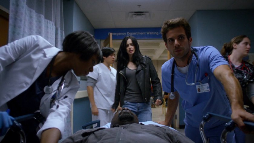 Doctors wheeling Luke to Metro-General emergency room while Jessica follows.