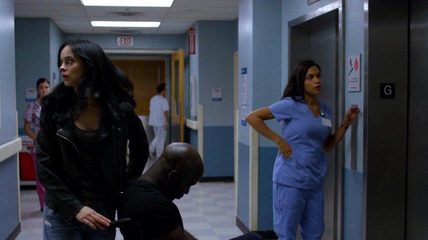 Jessica and Claire with an unconscious Luke waiting for an elevator in Metro-General hospital.