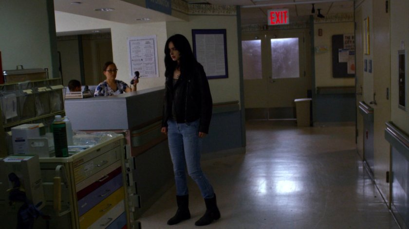 Jessica being offered a phone by nurse in Metro-General hospital.