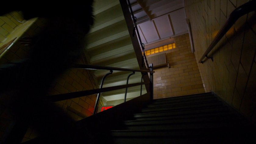 Jessica running down some Metro-General stairs.