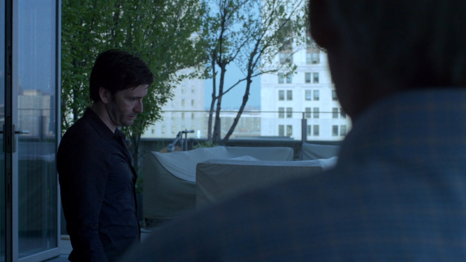 Albert talking to Kilgrave in New York City penthouse.