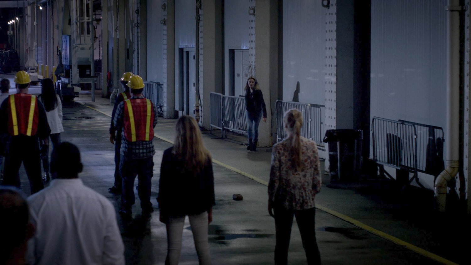 Trish approaches civilians on the Hudson Ferry Terminal dock.