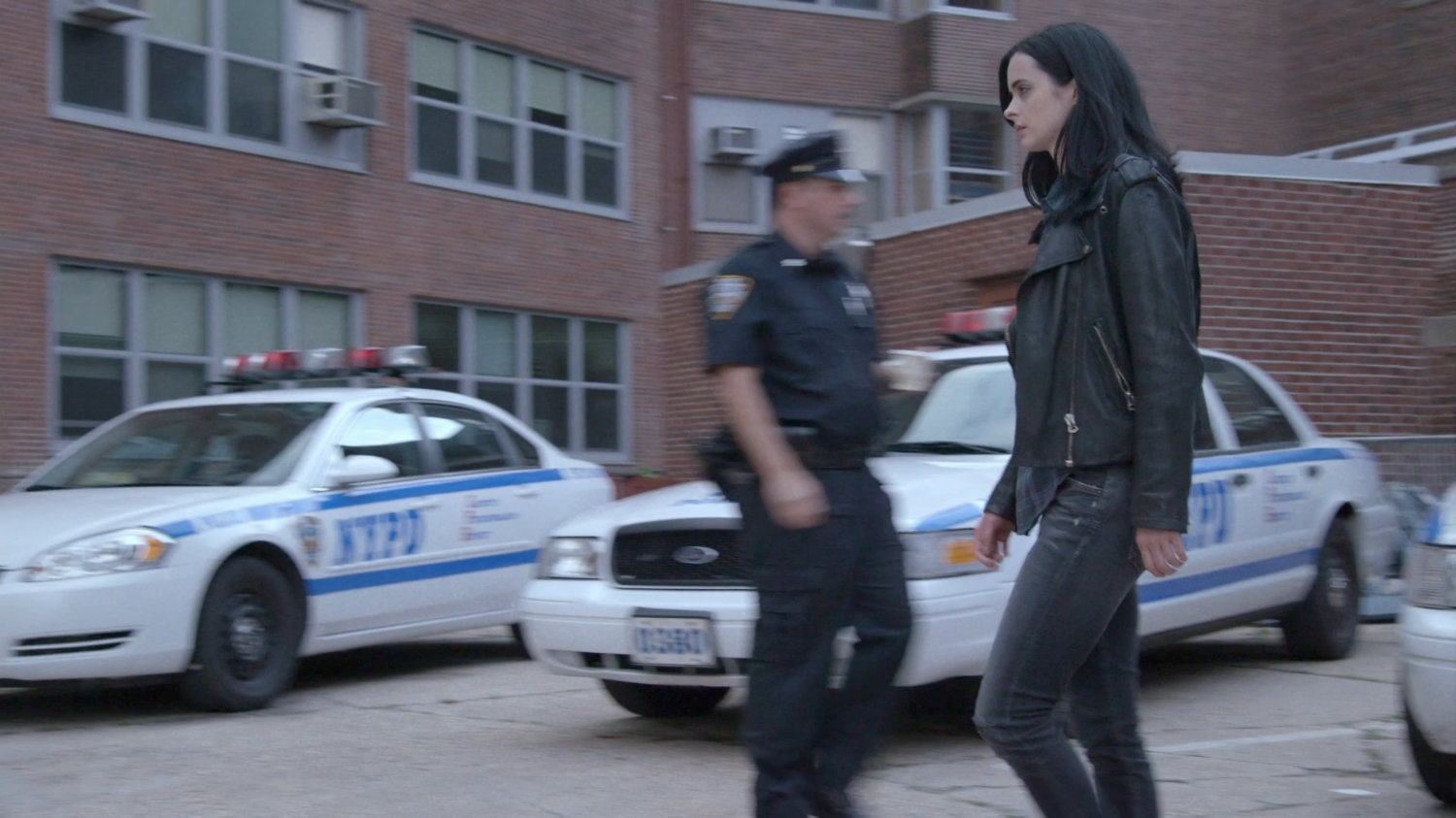 Jessica crossing 15th Precinct parking lot.