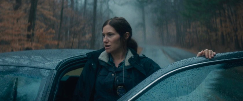 Agnes exiting car in New Jersey woods.