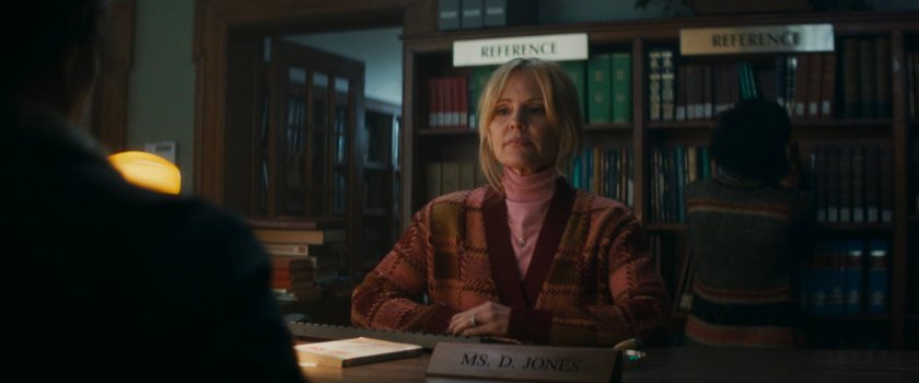 Dottie behind desk at Westview library.