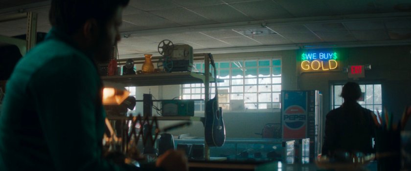 Agnes and Herb in pawn shop.