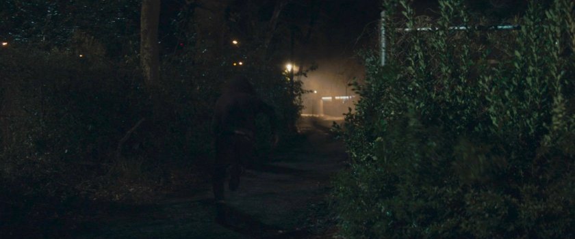 Teen running down alley behind Agnes's house.