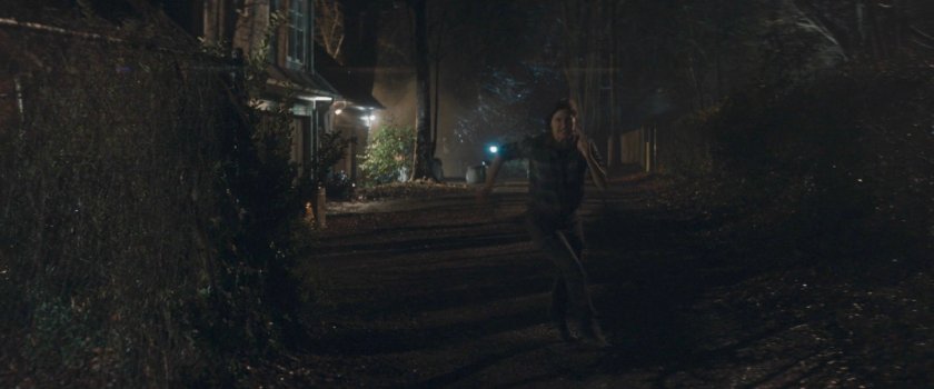 Agnes running down alley behind her house.