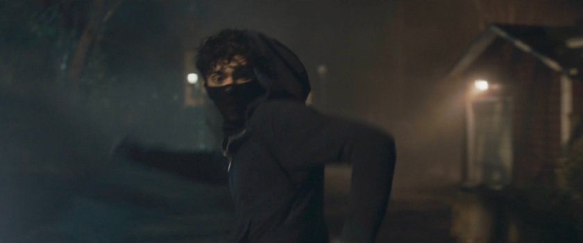 Teen running down alley behind Agnes's house.