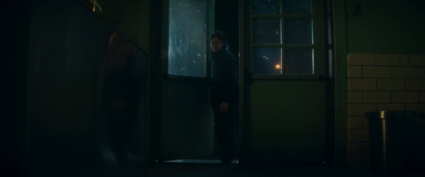 Agnes entering Westview coroner at night.