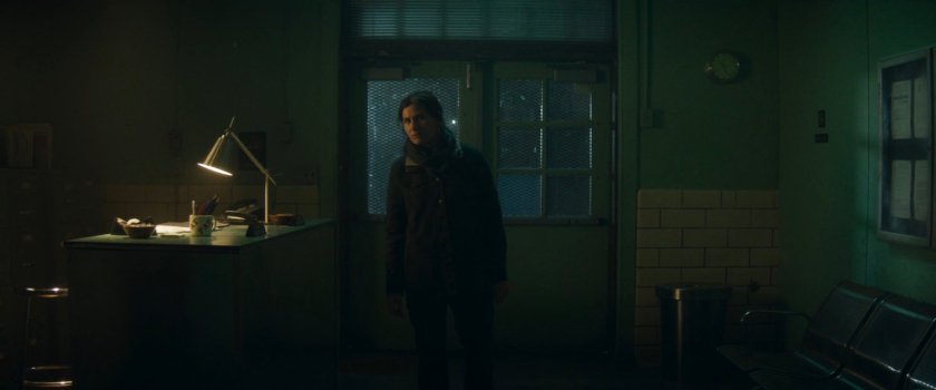 Agnes entering Westview coroner at night.