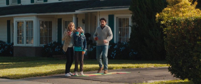 Dottie, Phil and their child outside their house.