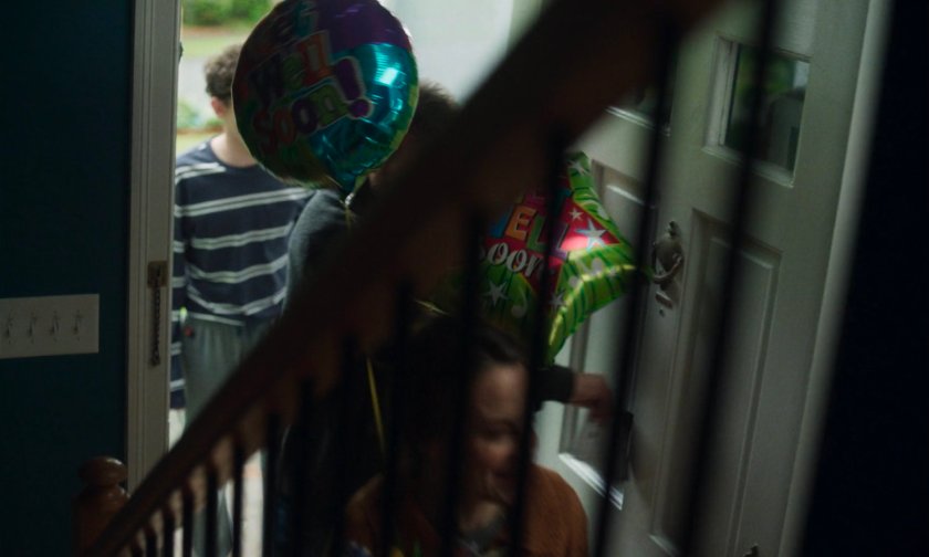 Billy and his parents entering their house.
