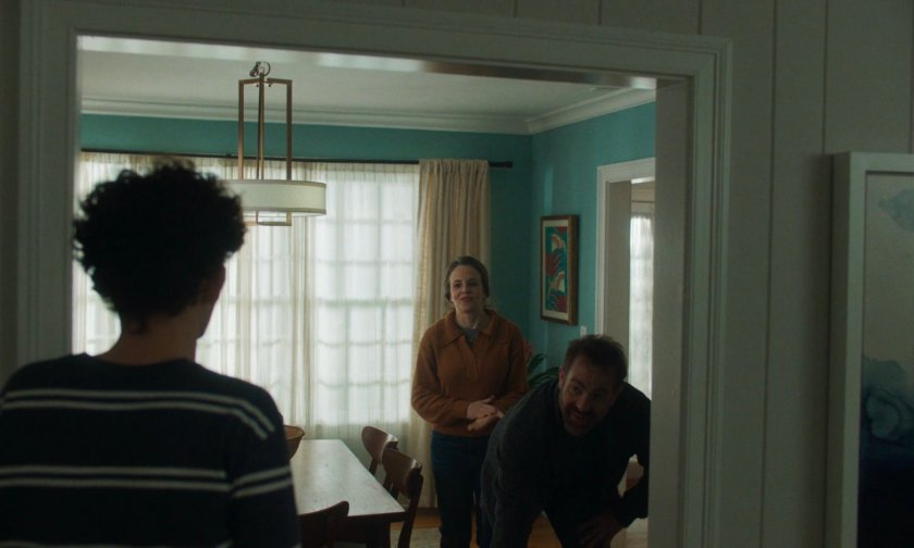 Billy and his parents in their house.