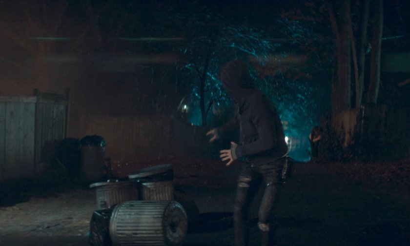 Billy running down alley behind Agatha's house.