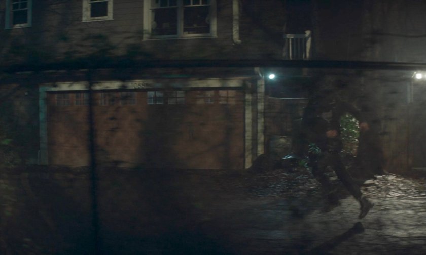 Billy running down alley behind Agatha's house.