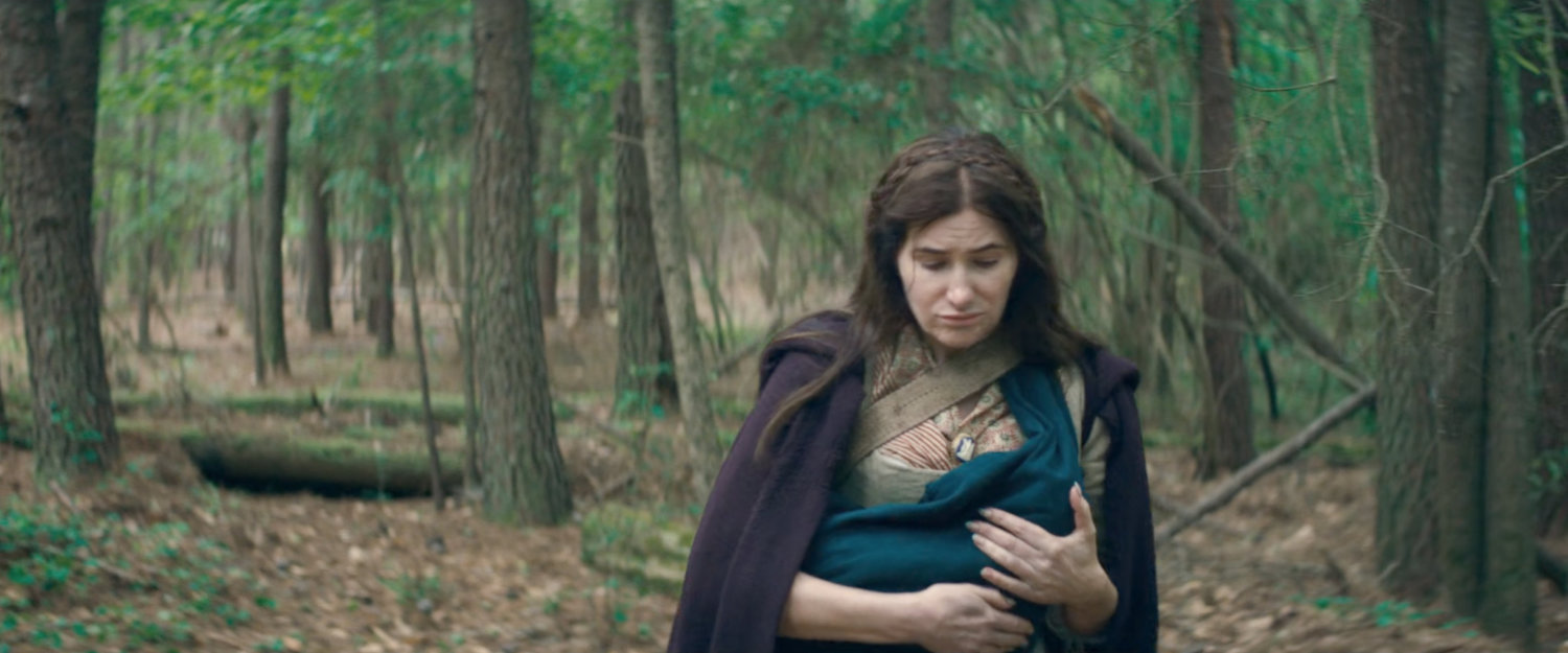 Agatha and child in New England woods, 1750.