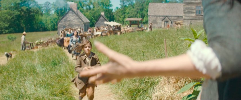 Villagers chasing young Nicky towards wooden cabin, 1756.