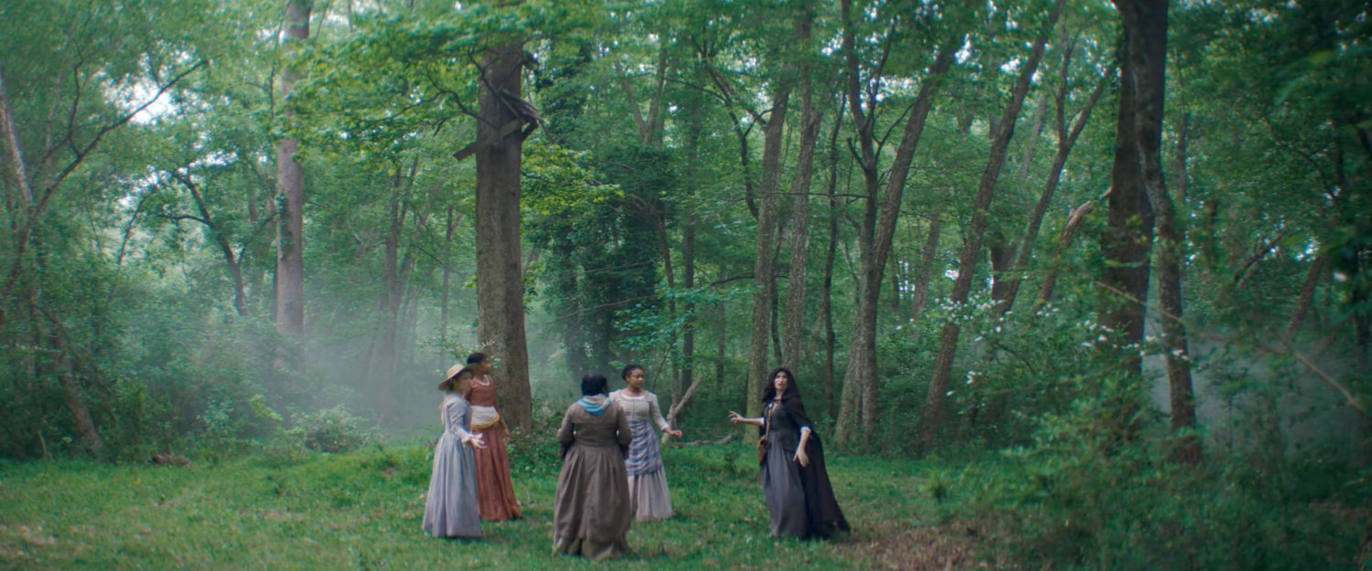Agatha and her coven in the woods.