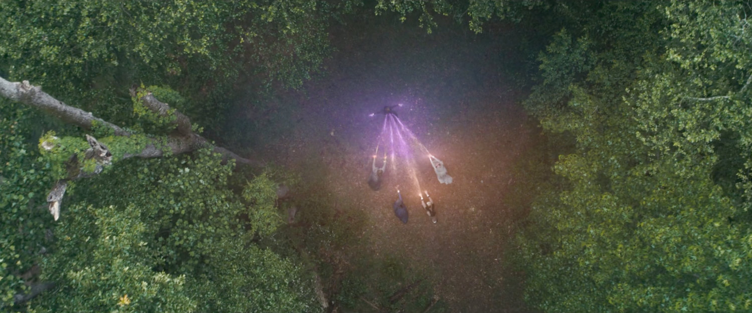 Aerial of Agatha and her coven in the woods.