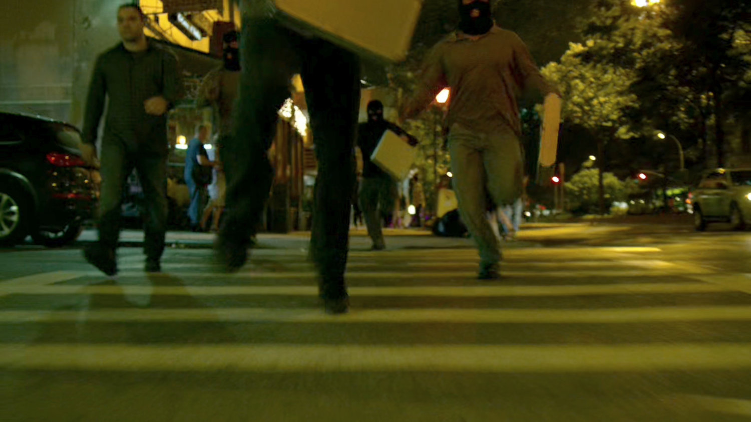 Diamond thieves running along a New York crosswalk.