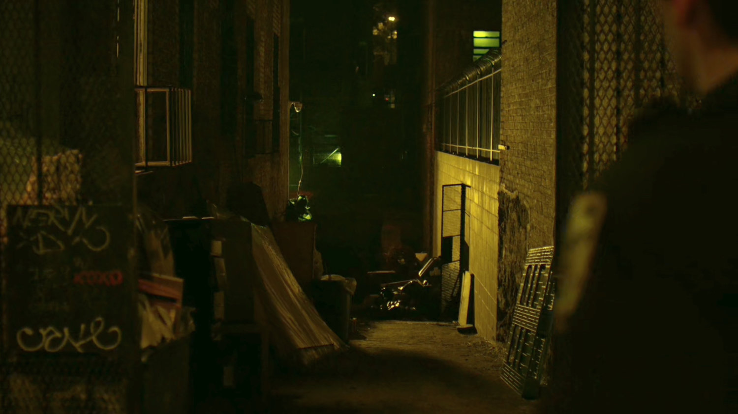 An empty alley from a police officer's POV.