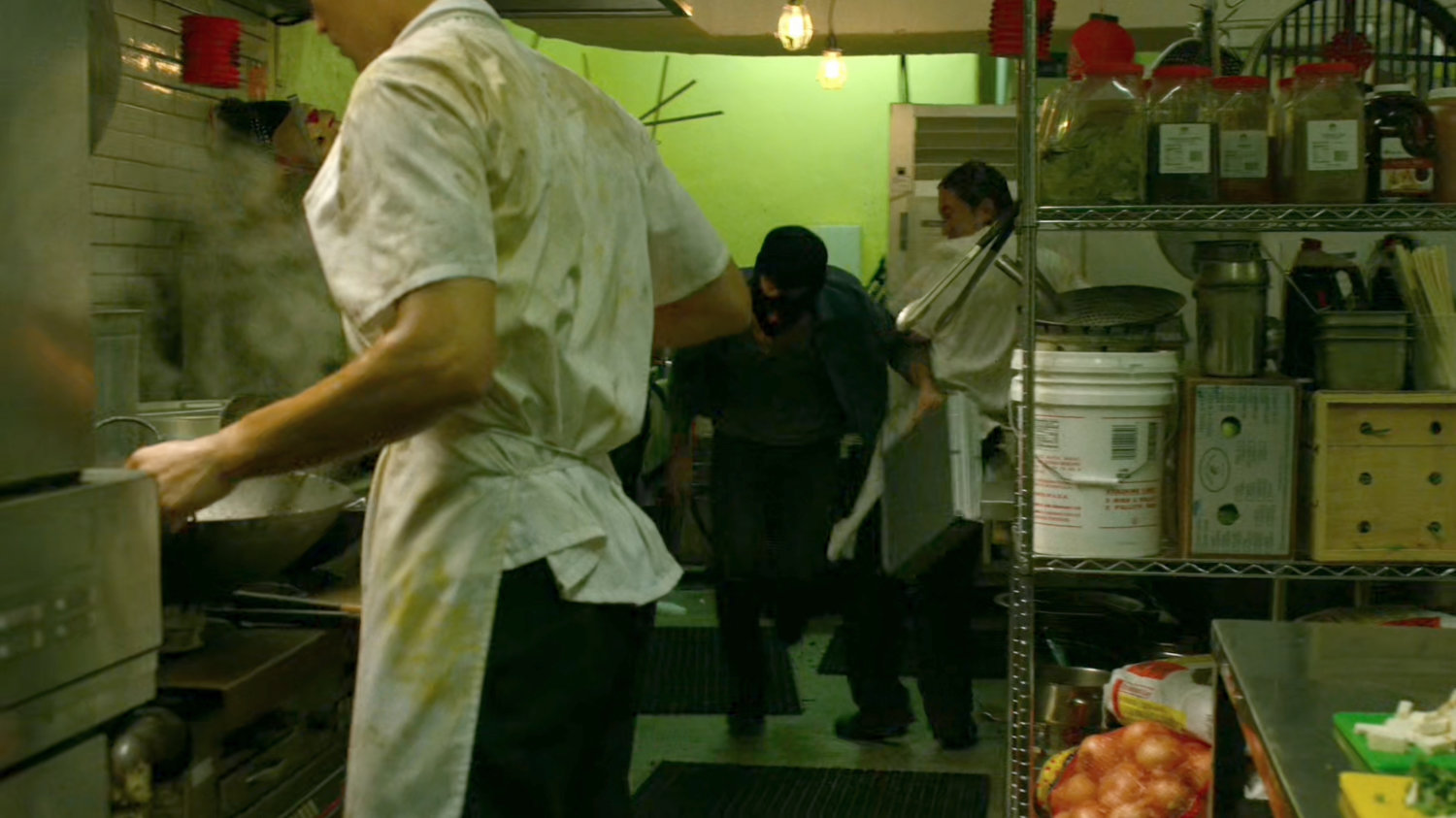 A diamond thief disrupts workers in a Chinese kitchen.