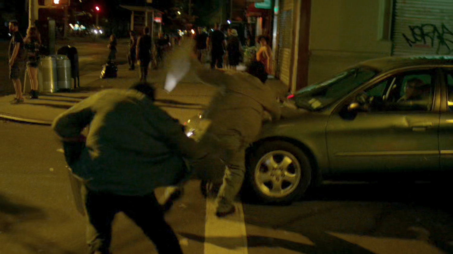 Diamond thieves run across a New York crosswalk, almost getting hit by a car.