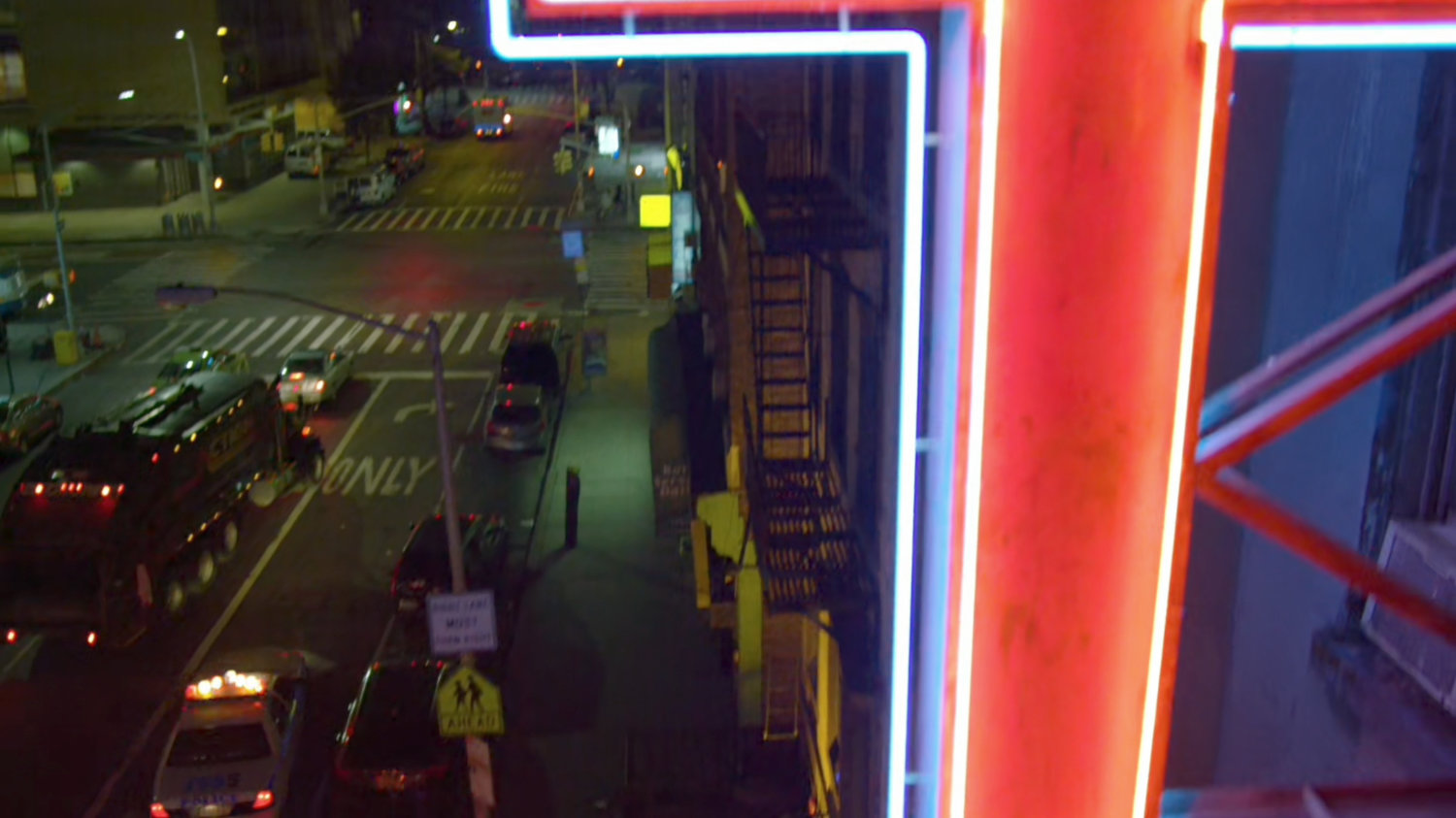 High angle view of police and thief on the sidewalk outside the Parrish of the Angels Church.